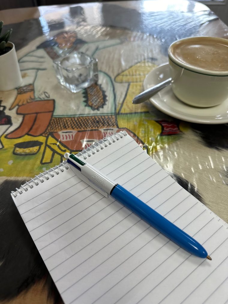 A cappuccino in a white cup on a saucer