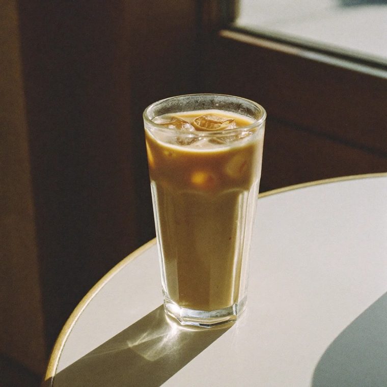 A tall glass of iced coffee